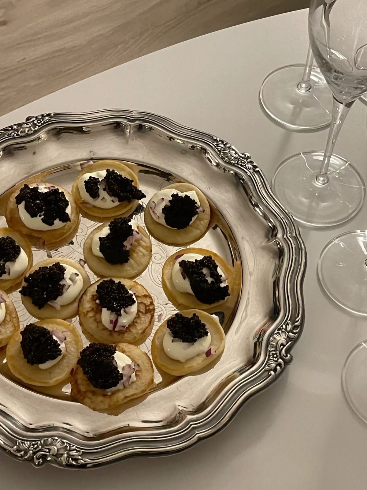 Caviar blinis on antique silver tray
