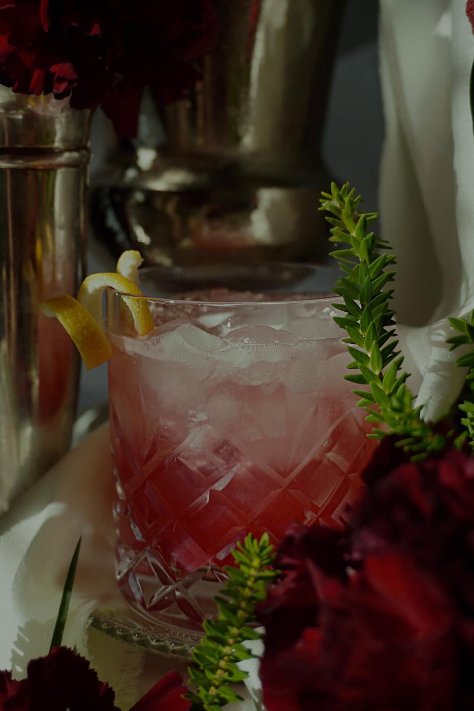 Red cocktail with dark florals
