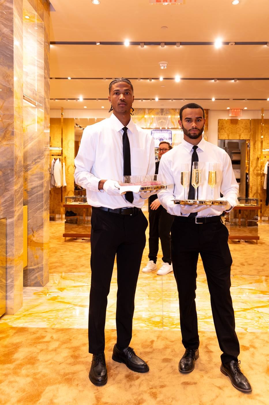 Staff with champagne at Dolce and Gabbana activation