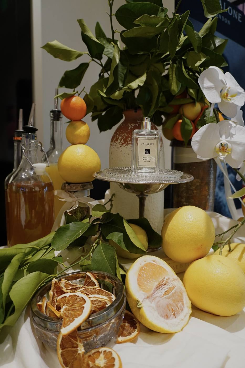 Jo Malone bar setup with citrus and orchids
