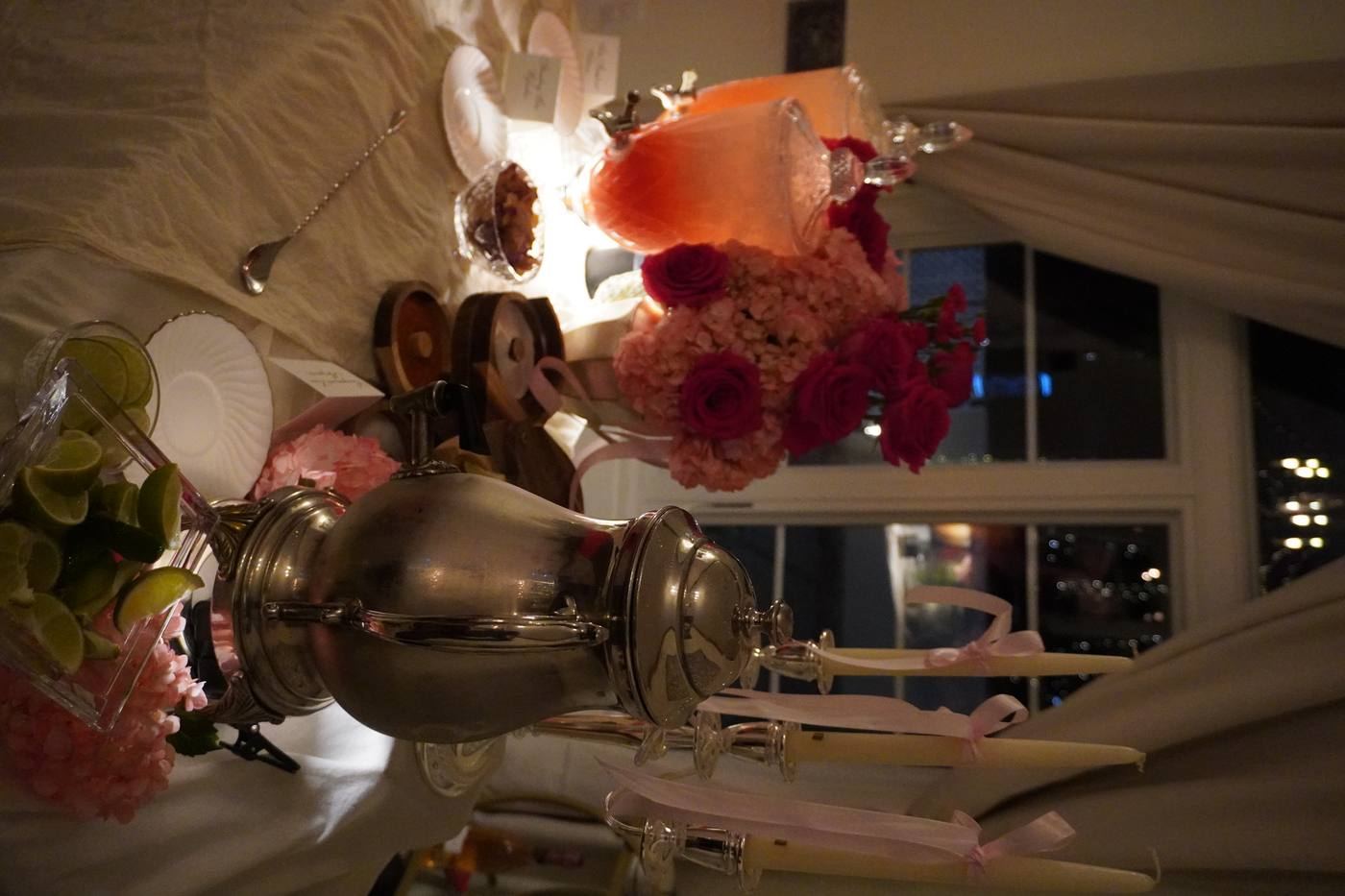 Evening bar setup with silver samovar and pink florals