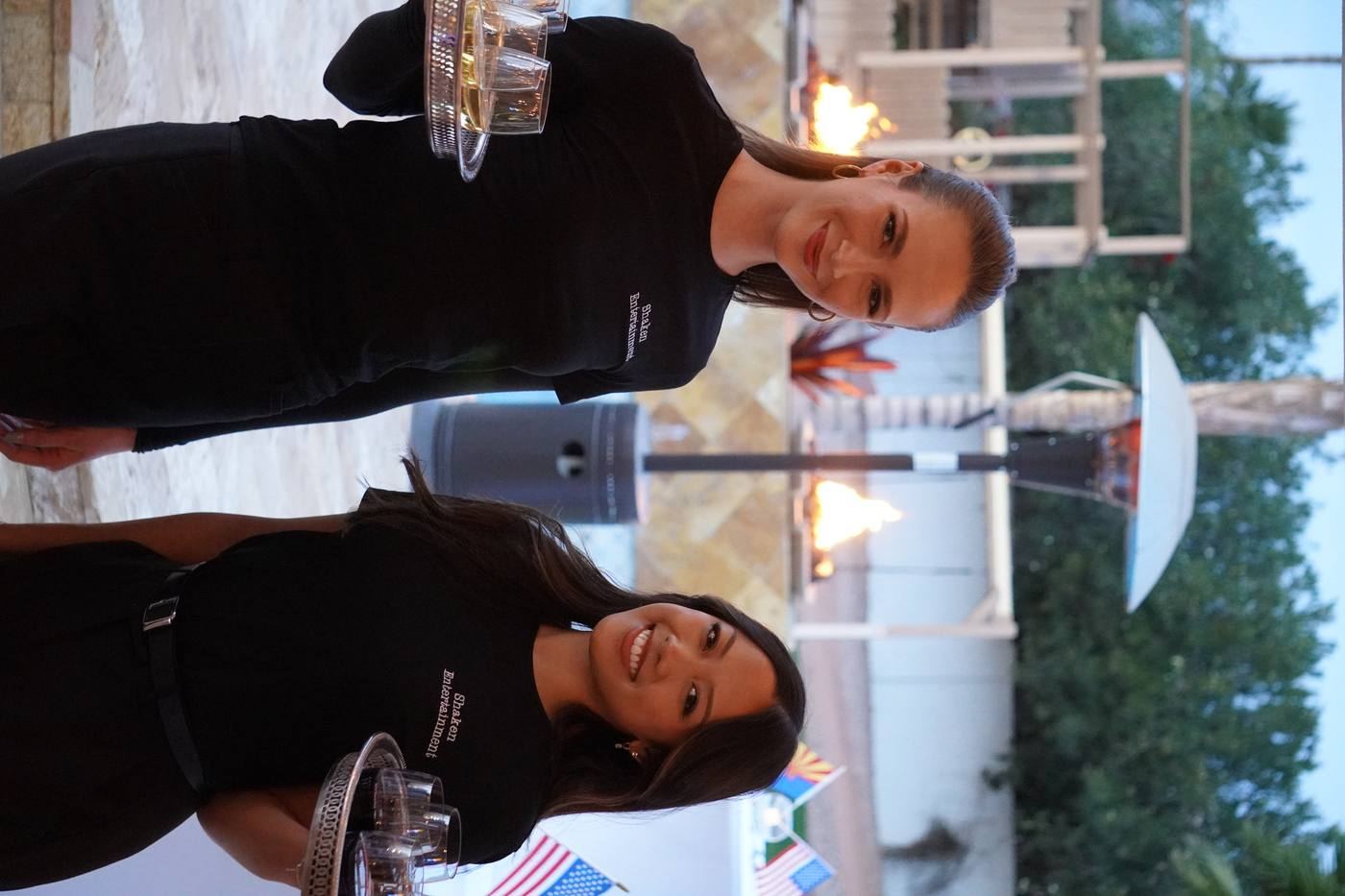 Shaken Entertainment staff in branded shirts with wine trays