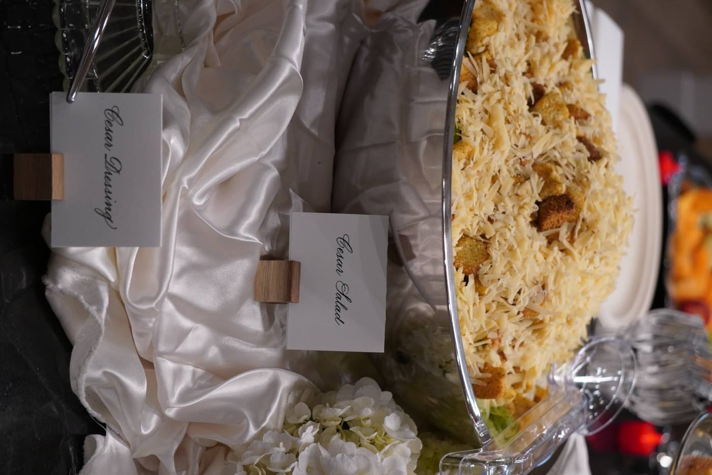 Caesar salad close-up with calligraphy card